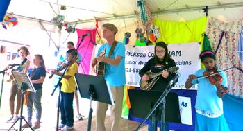 Dusk onstage with his J.A.M. music students
