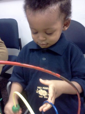 JACRYS WEARING BABY SOUL NAVY BLUE POLO STYLE SHIRT WITH METALLIC GOLD LOGO
