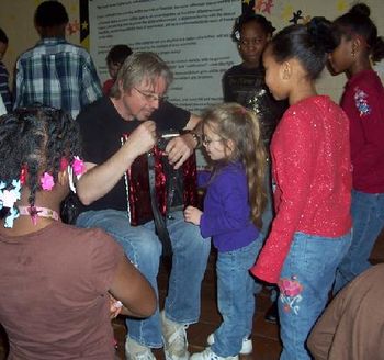 Dale showing the kids his accordian
