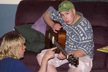 Our instructor Brad, with one of our guitar students
