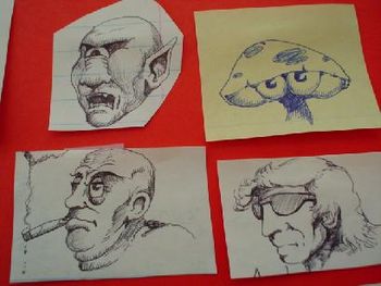 FOUR FACES, pen and ink by Olin Smith.
