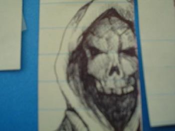SKULL FACE, pen and ink by Olin Smith.
