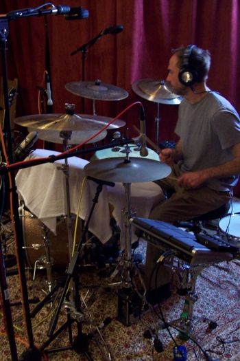 Chris Williams on the skins covered with towels
