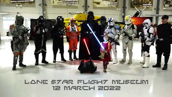 A young "Queen Amidala" bravely leads combined elements of the 501st and Rebel Legions at Houston's Lone Star Flight Museum for a "Hangar Talk" on the influences of WWII aviation on the Star Wars universe. PCD Photo
