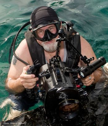 As he prepares to descend during a production for The Discovery Channel, Paul's smile shows his affection for the photographer, Monica Gephart.
