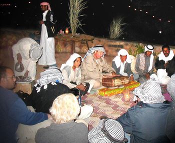 On a drum fashioned from a rusty, old jerry can, Paul jams with a band of Bedouins at their camp in the Sinai during filming of Paul's "Egypt - Karnak to Coral Reef." Photo: Randy Saletnik
