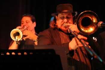 Mike Rinta (Trombone) Mike is an incredible talent. His ability to solo is like a carnival of sound. Mike's love for the intellectual side of music has proven to be a huge asset for him when scoring arrangements for the industry elite. He's the center piece of The Bingtones' big, rich and brassy sound. Contributions: Trombone solo, "Mr. DJ" Wrote horn arrangements on "Mr. DJ" "Funk With Me" "Time Of Our Life"
