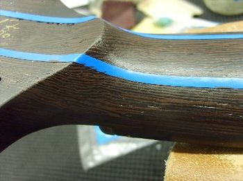 The repair is oversprayed with a custom mixed shader, and the faux graining technique is applied.
