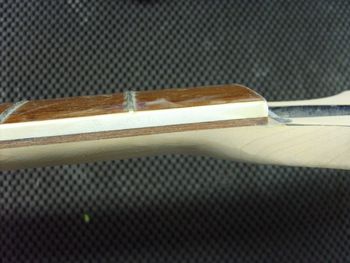 The old fretboard seperation is history, and the neck is now rock solid....
