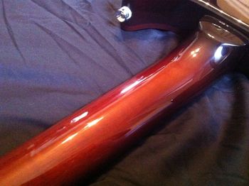 The hand-shaped Honduras mahogany neck features a symetrical chunky 'V' profile from the volute down to the heel transition.  The sunburst lacquer finish is carried over from the beautiful maple top.
