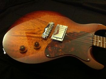 The Brave's maple top is slightly arched and radiused where the player's arm rests.  A welcome feature on ANY guitar.
