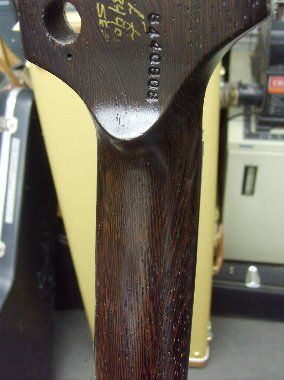 The serial number is restamped and topcoats are sprayed.
