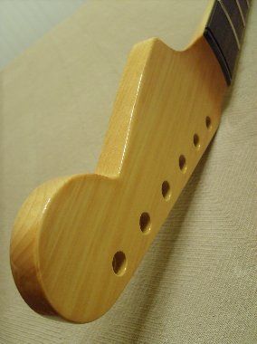 Ambered nitrocellulose lacquer will be sprayed over the entire neck at this point
