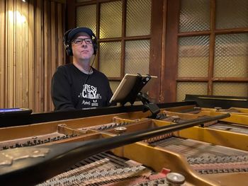 Piano on several tracks played by John, Critical Misunderstandings On The Precipice album sessions.
