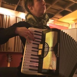 Marianne plays accordion during Tendrils album sessions.
