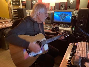 Phil plays Gord's 12 string acoustic guitar as we listen in the studio to Our Love Was In Danger and Gord’s various brilliant drum tracks. Critical Misunderstandings On the Precipice sessions.
