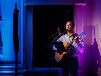 Solo singer guitarist performing at Omni Parker House in Boston, MA for annual corporate networking meeting.