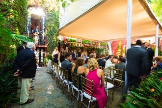 Wedding singer performing acoustic guitar music for wedding ceremony in Mexico.