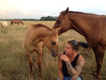 Good friend, Cody visiting with the 2014 foals.
