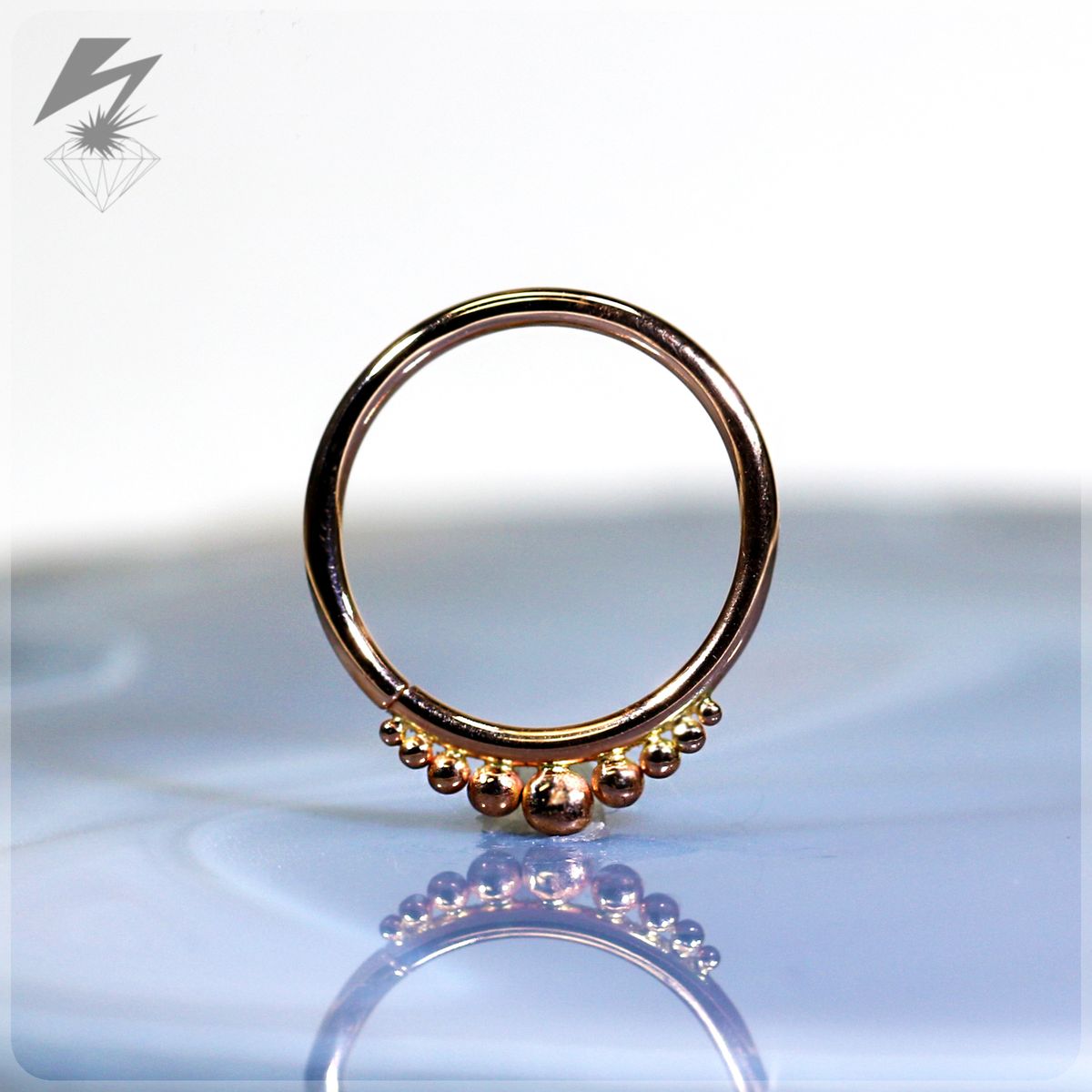 16g. 1/2" 9 Bead Rose Gold Ring