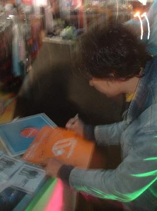 Ralph of Kyau vs. Albert Signing Sky's Copy of 'Made of Sun' @ Grooveriders
