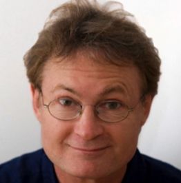 Headshot of Greg Tamblyn looking at camera