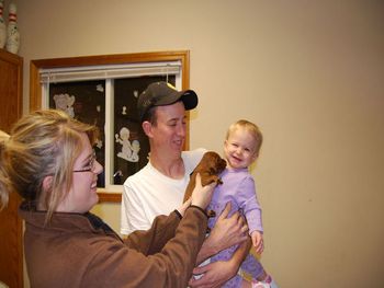 This is my daughter showing a puppy to my grandaughter. They were both too cute!!
