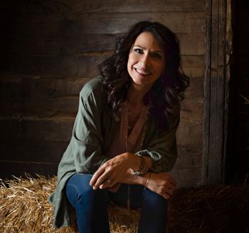 Jean in a "stable filled with hay" (a line from one of the songs)
