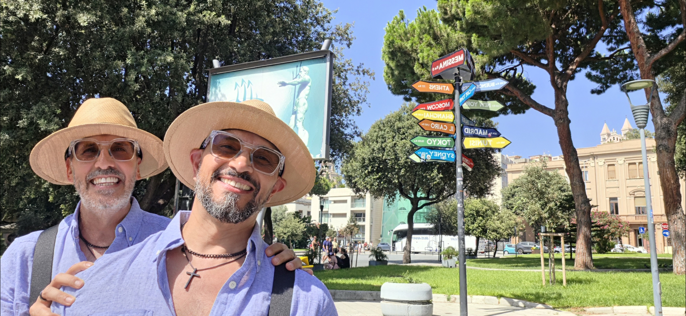 The World’s No.1 Superstar® and husband Richard visit Villa Mazzini in Messina, Sicily, Italy, posing beside the iconic international destination signpost—a powerful manifestation of Sidow Sobrino's limitless global influence across continents.
