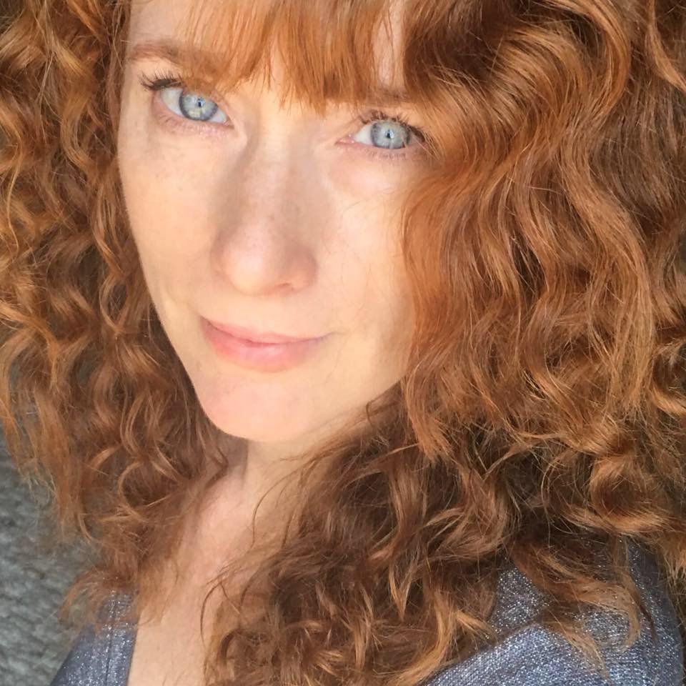 Heather Richards, American singer-songwriter and The Adirondack Songbird, portrait with curly hair and warm natural expression representing Traditional Country, Americana, and Bluegrass music