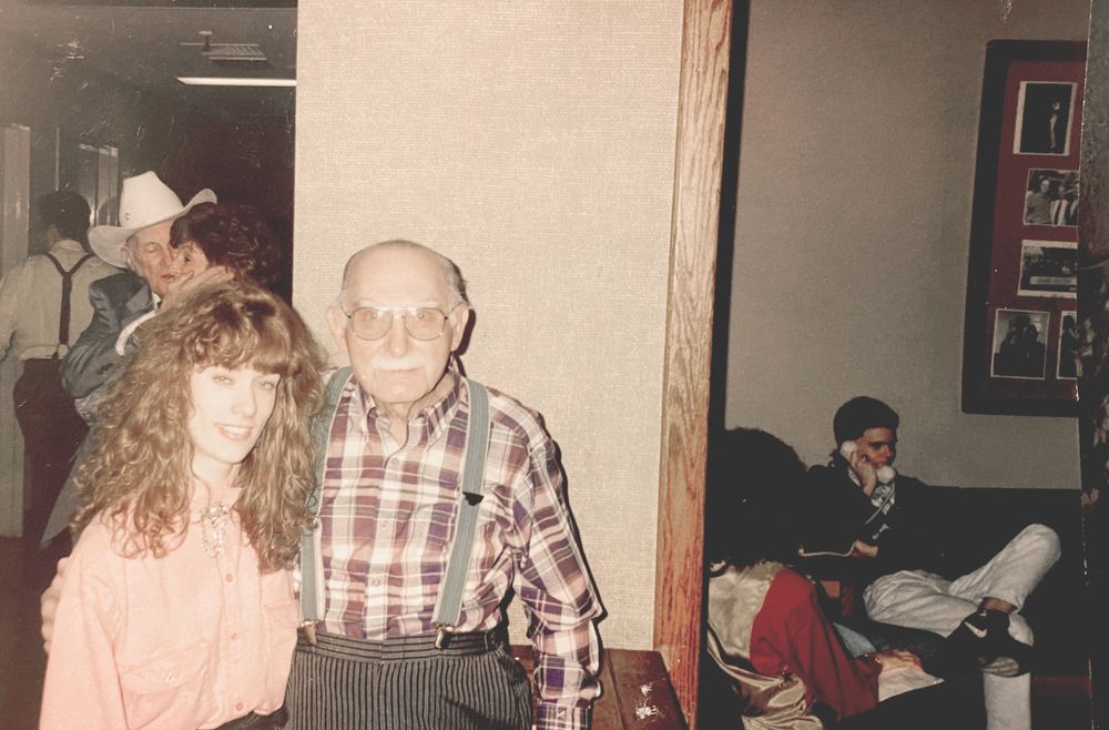 Heather Richards posing with country music legend Grandpa Jones in an archival backstage photograph