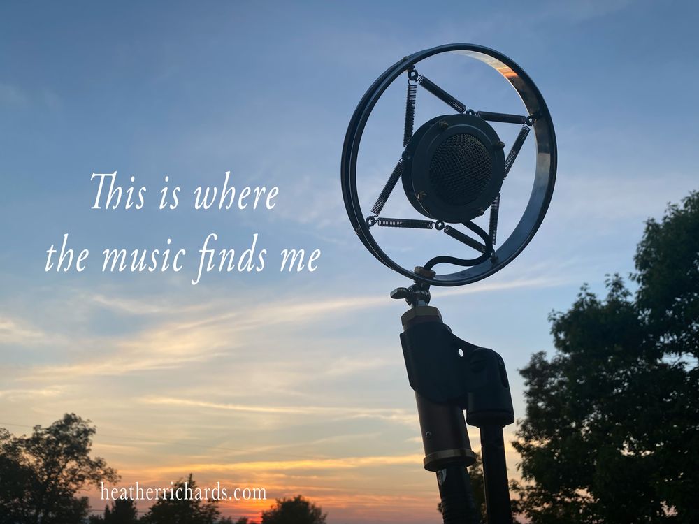 Vintage microphone standing against a sunset sky in the Adirondack Mountains where Heather Richards finds inspiration for her Traditional Country, Americana, and Bluegrass songs