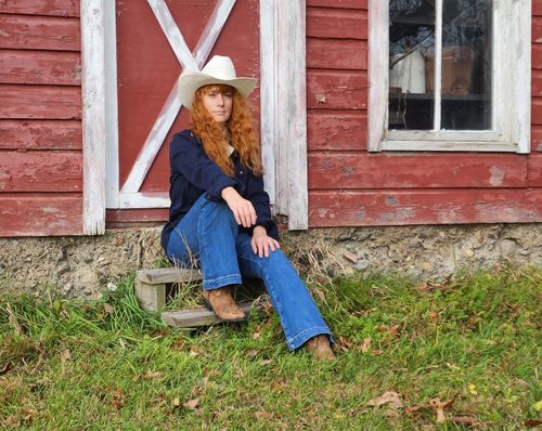 Heather Richards at red Adirondack barn