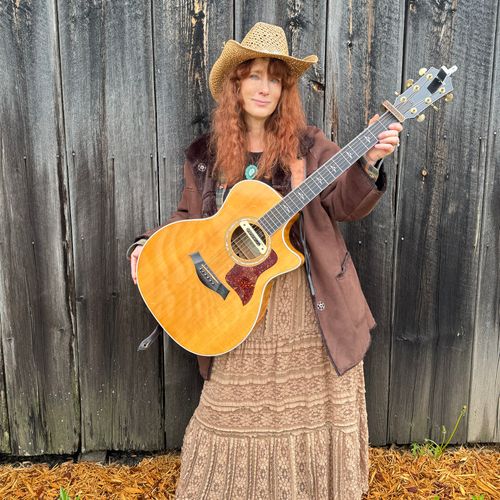 Heather Richards with guitar at Adirondack barn