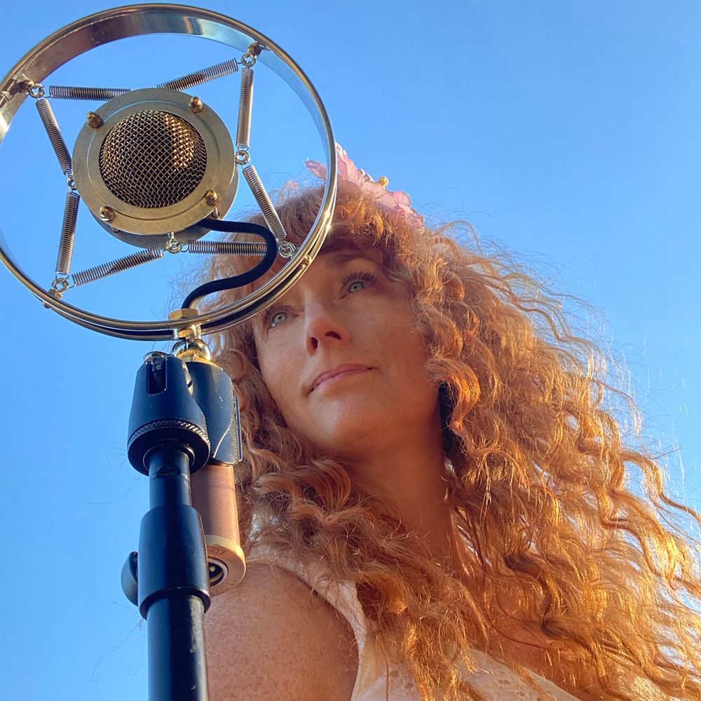 Heather Richards portrait with vintage microphone for press and promotional use, American singer-songwriter performing Traditional Country, Americana, and Bluegrass music.
