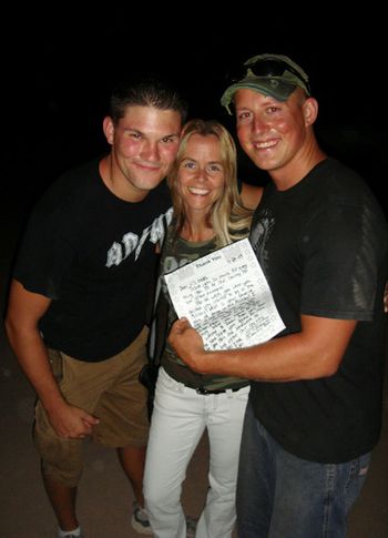 Molly, soldiers Bam Bam, and Doug with the letters her daughters class wrote to the troops at each base!
