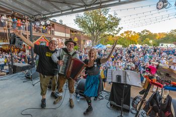 Fun Wurstfest crowd!  Ross and Valina pictured with our late, great drummer, Jeff Ryder at the Stelzenplatz in November 2019.  Photo by Mark Hiebert
