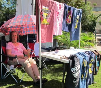 Mom selling Prost Y'all t-shirts on a hot day in the Woodlands
