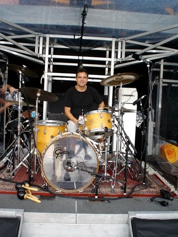 Sitting behind Charlie Watts' drum kit
