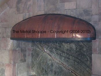Small Rustic Barrel Style Copper Hood with Forged Steel Accent. / Location: Armona, CA
