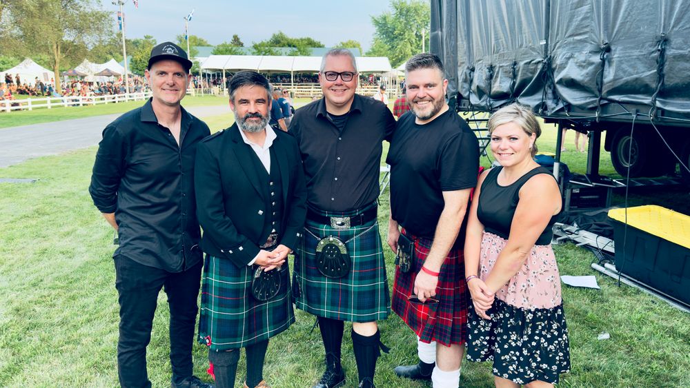 Group photo of Hadrian’s Wall at the Glengarry Highland Games featuring Richard Irwin, Ewen McIntosh, Neil Emberg, Terry O’Farrell and Ashley MacLeod-McRae.