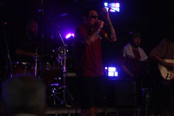Dub Catalyst's vocalist spitting out the lyrics at Beautiful days Festival 26 | The Source Studio

