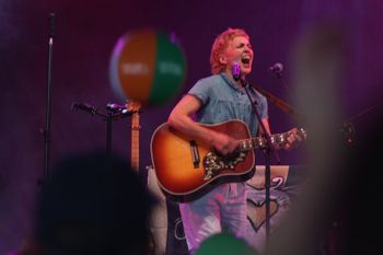 Hannah from Sound of the Sirens kicking out the jams at Beautiful days Festival 26 | The Source Studio Exeter
