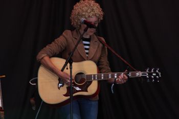 Abbe from Sound of the Sirens rocking out at Beautiful days Festival 26 | The Source Studio Exeter
