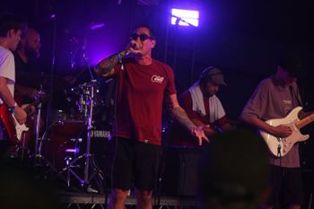 Dub Catalyst's big Dave blowing up the stage at Beautiful days Festival 26 | The Source Studio
