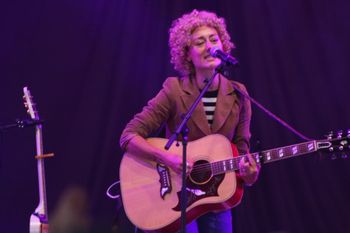 Abbe from Sound of the Sirens singing to the crowd at Beautiful days Festival 26 | The Source Studio Exeter
