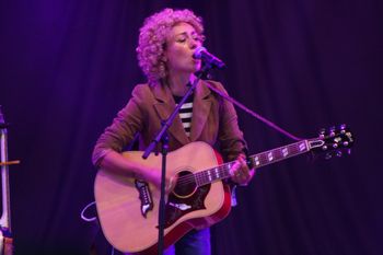 Abbe from Sound of the Sirens singing  sweet music to the crowd at Beautiful days Festival 26 | The Source Studio Exeter
