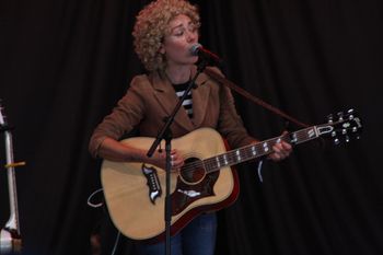 Abbe with her guitar & Sound of the Sirens mesmerising the crowd at Beautiful days Festival 26 | The Source Studio
