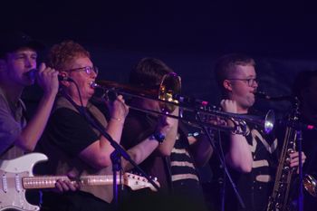 Dub Catalyst's horns captivating the crowd at Beautiful days Festival 26 | The Source Studio
