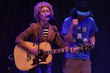 Exeter legend Abbe Wood from Sound of the Sirens mesmerising the crowd at Beautiful days Festival 26 | The Source Studio Exeter
